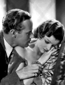 Myrna Loy and Leslie Howard